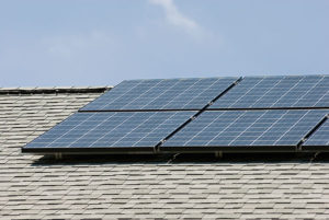 A rooftop solar panel system at Jim Winkle's Madison home collects solar energy on June 12, 2007. Winkle, a systems programmer with the Division of Information Technology (DoIT) at the University of Wisconsin-Madison, recently installed the solar panel system, designed to support his household's annual 2,000 kilowatt-hours energy need.<br />