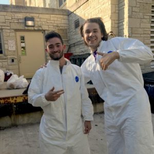 Cordell Murphy and Erich Kuss suit up for a trash audit at Waters Residence Hall.