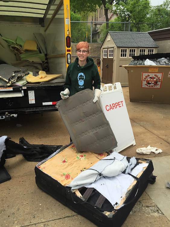 Maddy Sicora deconstructed a futon while volunteering at Sustainability Move Out