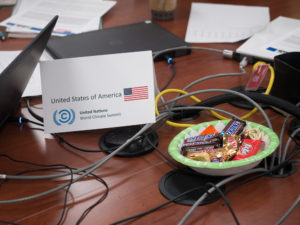 Whereas less developed countries get plain pretzels (and some must sit on the floor), rich countries like the United States are given candy bars and normal seating. This reinforces the unequal economic contexts each group must adopt. Photo by Nathan Jandl.