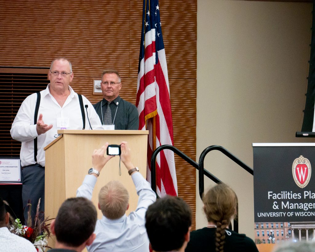 Lyle Jelle accepts the Platinum Award at the FP&M Employee Recognition Awards ceremony.