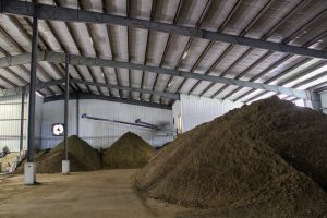 Indoor windrows maintained by Carbon Cycle Consulting finish the composting process. Photo by Trina La Susa.