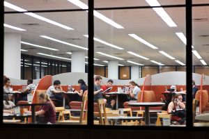 Students with laptop computers study and socialize within College Library's Open Book Cafe in H.C. White Hall at the University of Wisconsin-Madison at night on March 20, 2012. (Photo by Jeff Miller/UW-Madison)