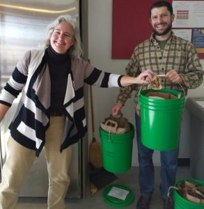 Lakeshore Nature Preserve's Rhonda James (left) and Adam Gundlach (right) helping with compost. 