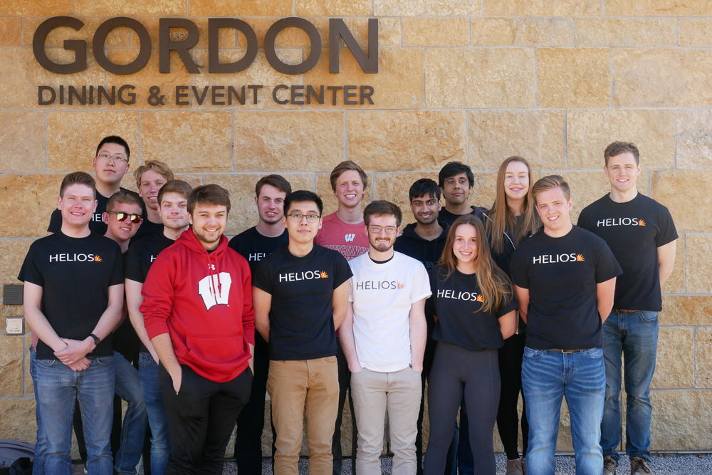 Helios members pose in front of Gordon Dining & Event Center following the successful installation of the solar array.