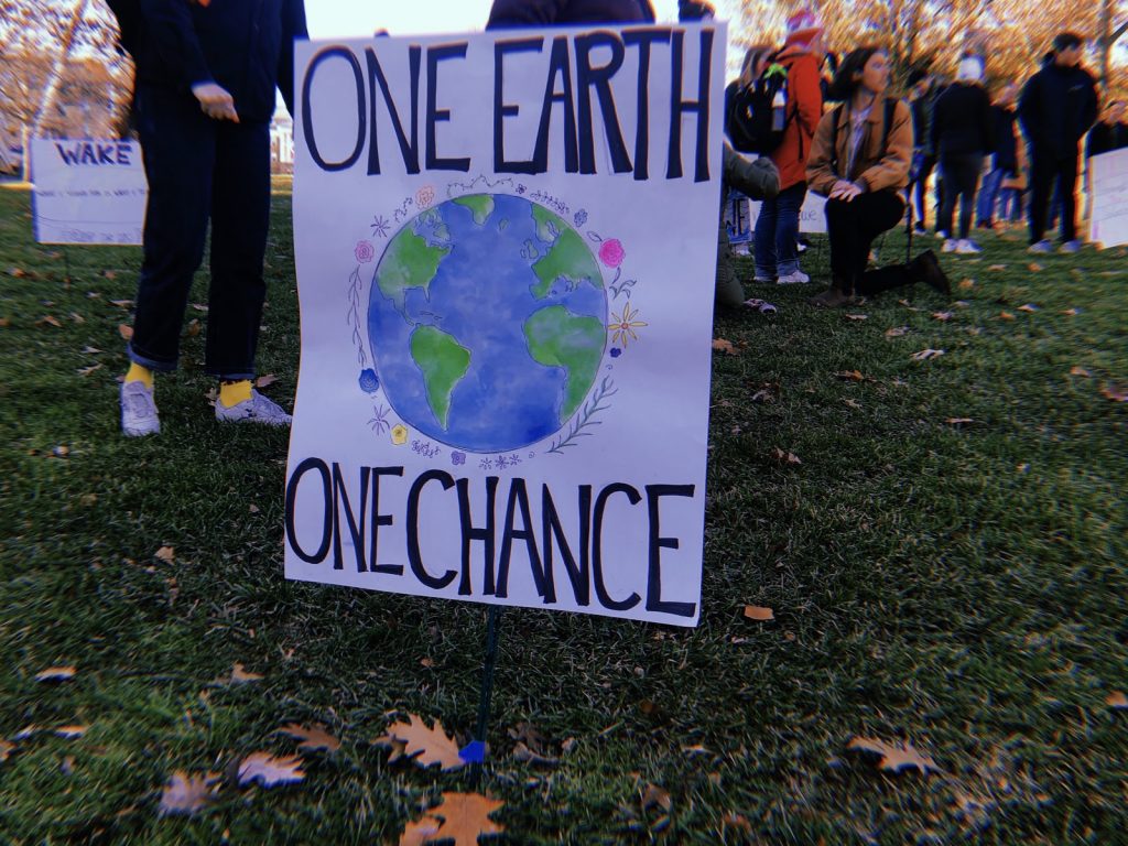 A student poster on Bascom Hill during the climate strike on Dec. 6, 2019. Photo by Norma Behrend-Martinez.