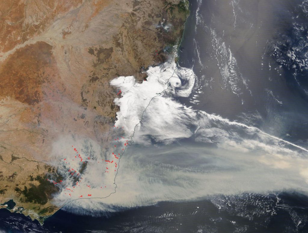 Snapshot of southeastern Australia from January 2, 2020 showing identified fires (red dots) and smoke streaming out to sea. Imagery from the NASA Worldview application (https://worldview.earthdata.nasa.gov), part of the NASA Earth Observing System Data and Information System (EOSDIS).