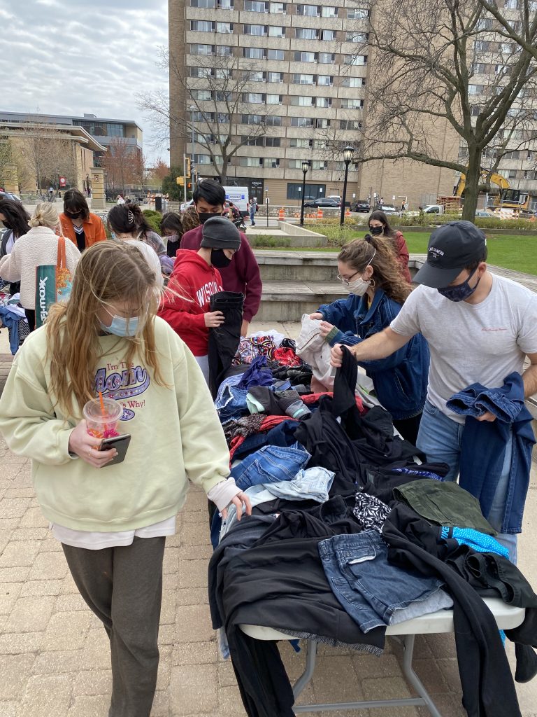 Participants at the ASM Clothing Swap browse the selection. 