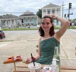 Photo of Suzie Kazar sitting at a table outside