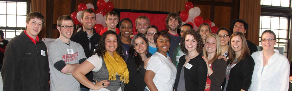 Travis Blomberg as an undergraduate standing with classmates during his studies with the Nelson Institute. 