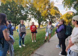 Students listen to the presenter on a tour