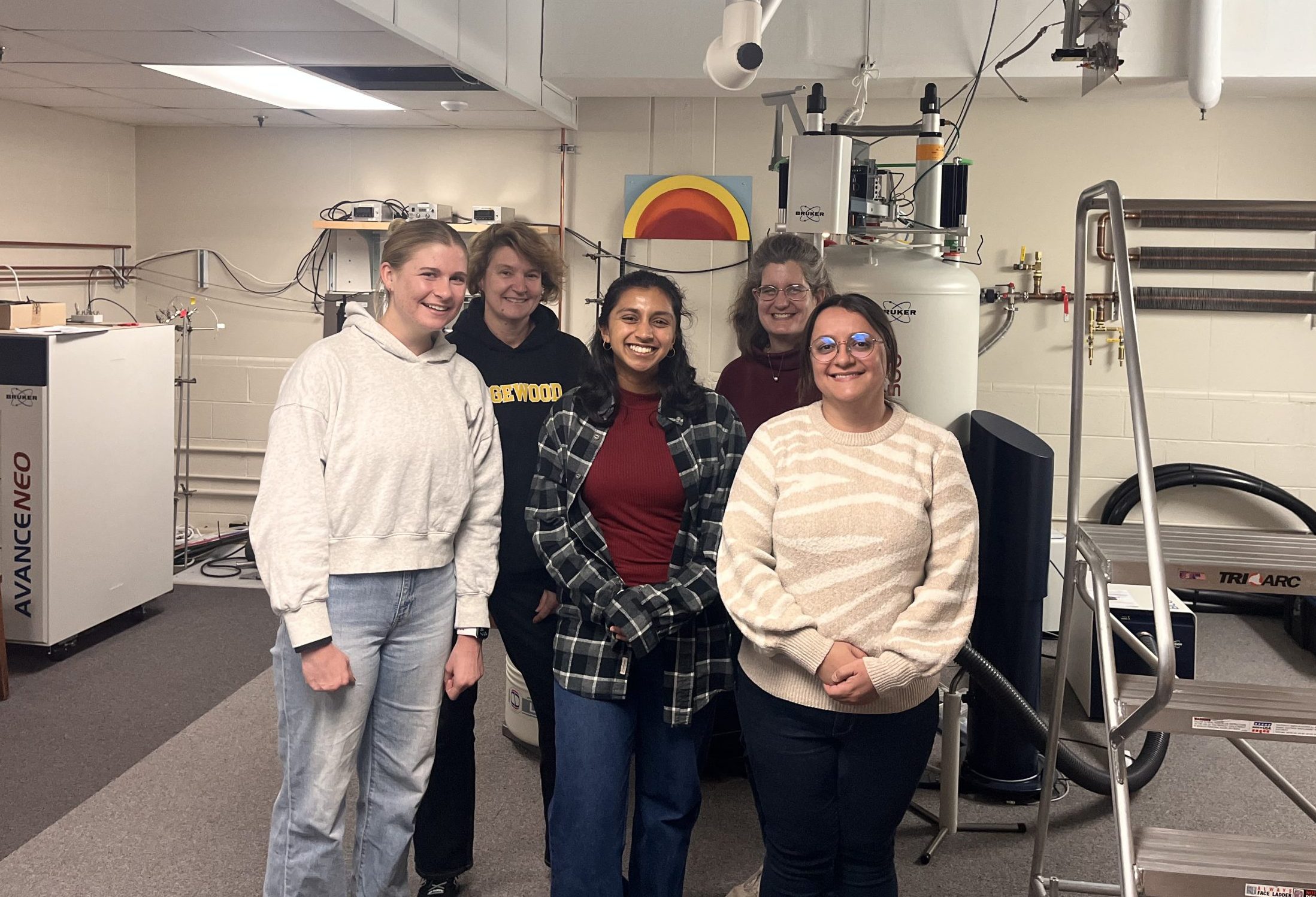 Student Interns with Magnetic Resonance Lab leaders in front of their EMR spectrometer
