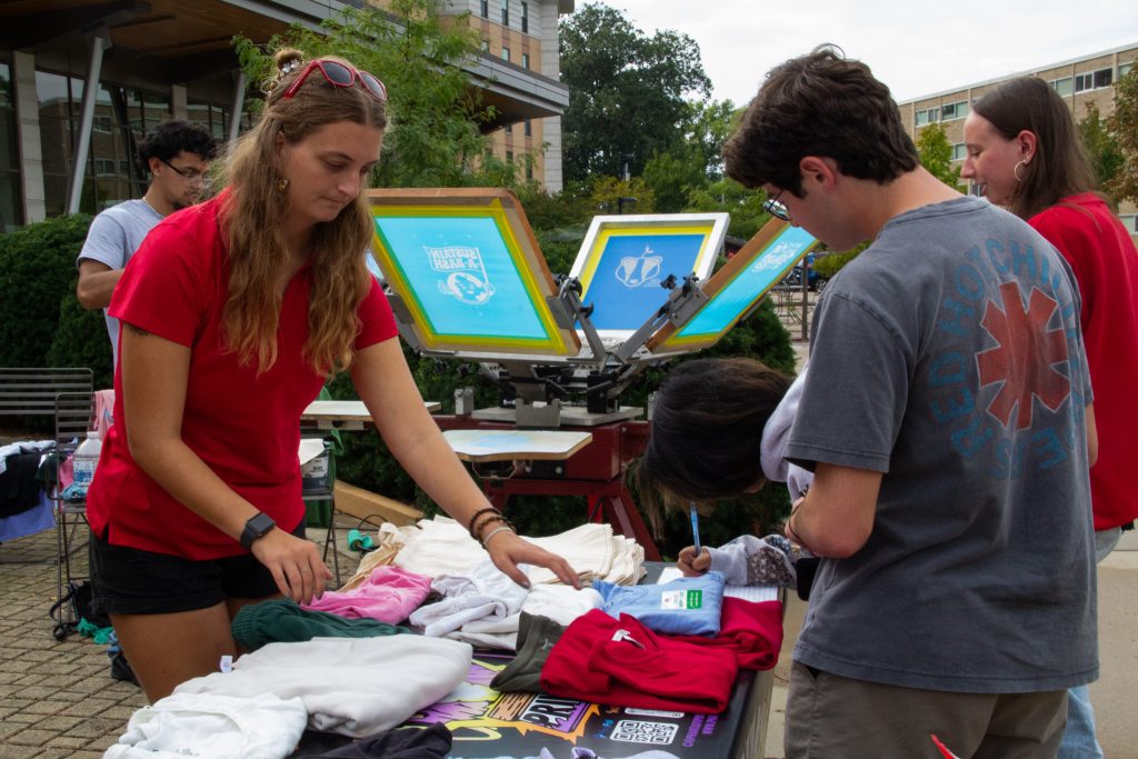 Students picking out their clothing item to be screen printed.