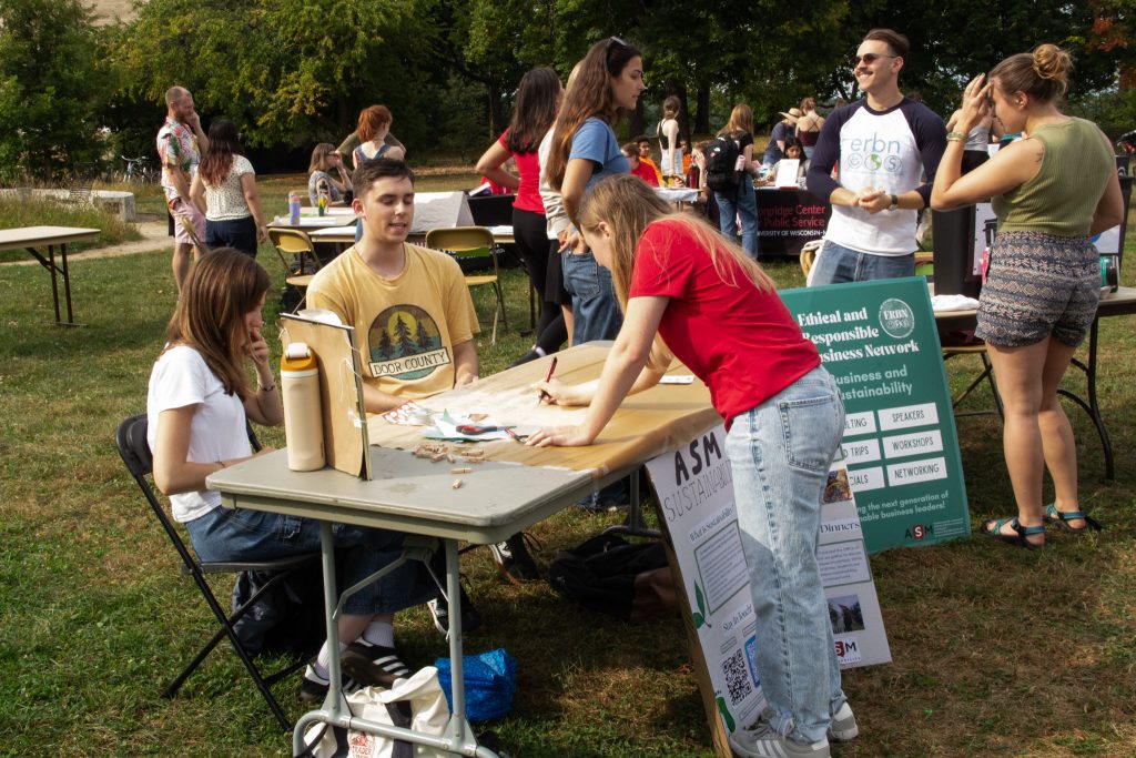 Student visiting an organization's table.