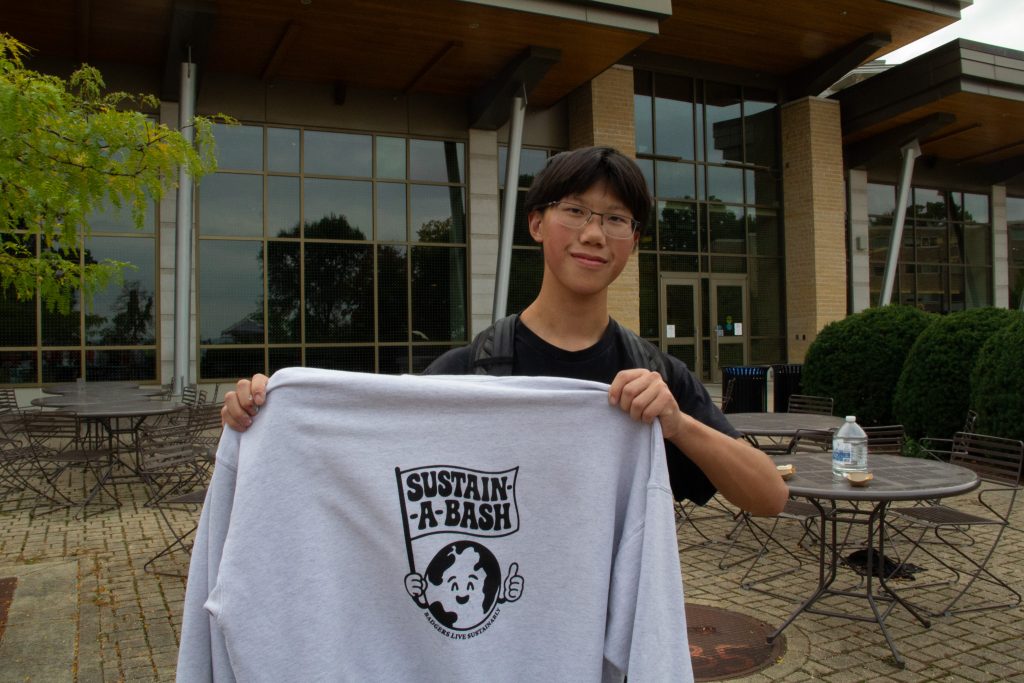 Student showing off his screen-printed sweatshirt.