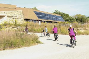Event attendees test riding the new BCycles and ringing their bells to celebrate.
