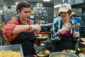 Students assemble meal package at Nutrition Access Program headquarters.
