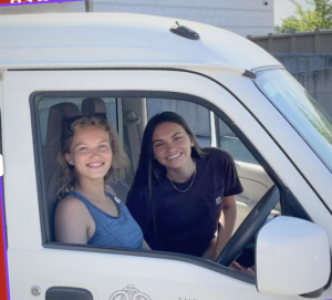 Olivia and co-worker Rachel driving in OS vehicle