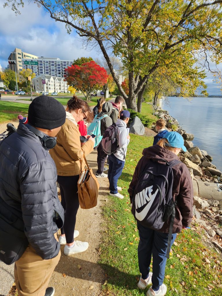 A group of students by the lakeshore