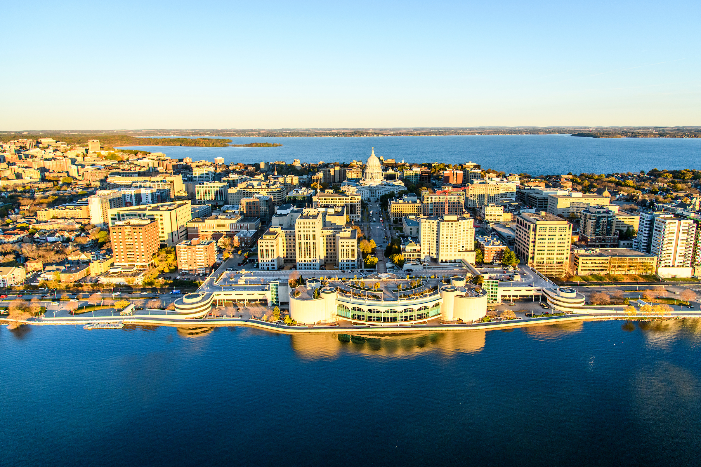Lake Mendota and Lake Monona, along with the downtown Madison Isthmus and Wisconsin State Capitol, are pictured in an early morning aerial