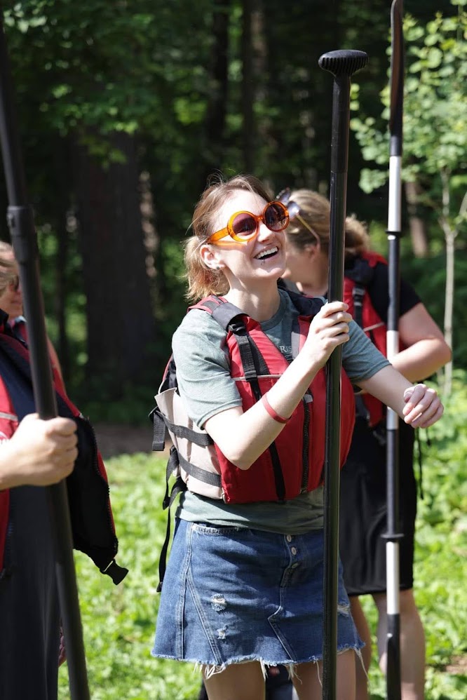 Gullickson is smiling in a lifejacket with her cohort mates.